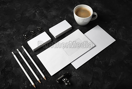 Photo of blank stationery set on black plaster background. Blank stationery and corporate identity template.