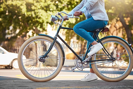 Adventure,  street travel and bike break outdoor in urban city in summer. Woman with vintage bicycle in a road for transport. Sustainability person traveling with health mindset or healthy energy.