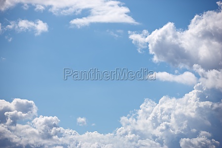 Blue sky,  clouds and background in nature,  outdoor and climate with space,  pattern or heaven. Environment,  cloud and natural shape for meteorology,  weather and air with light,  freedom and summer.