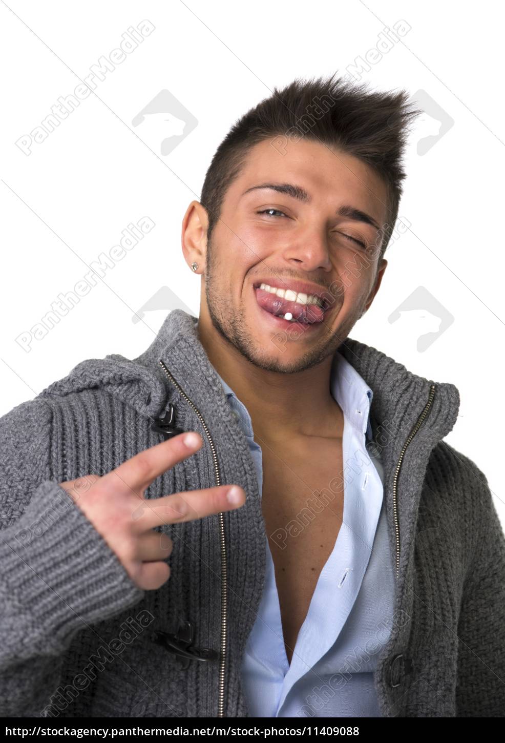 Attractive young man with tongue piercing doing - Royalty free photo  11409088 | PantherMedia Stock Agency