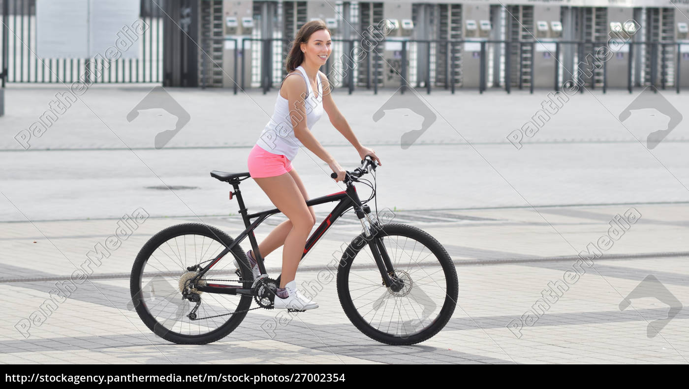 Sexy girl with bicycle. Young slim sexy sporty woman - Stock image  #27002354 | PantherMedia Stock Agency