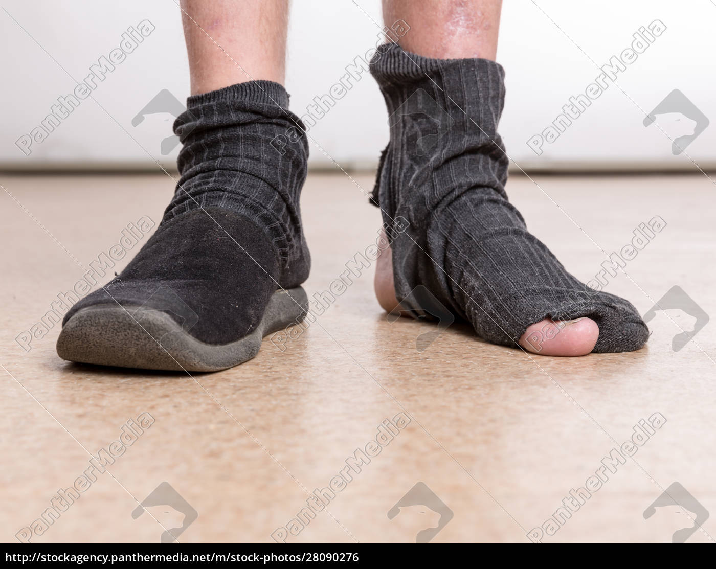 Male feet with sock in hole - Royalty free photo #28090276 | PantherMedia  Stock Agency